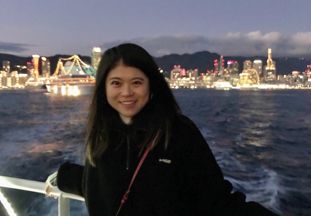 Sichao (Fiona) Jiang by the water at night